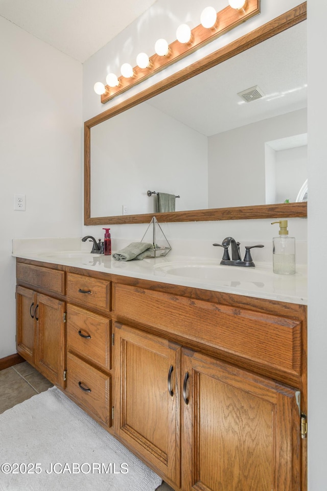 full bathroom with double vanity, visible vents, and a sink