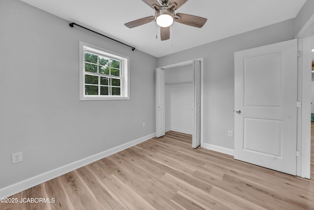 53036 Bird Haven Rd, Centertown, MO 65023 - unfurnished bedroom featuring light wood-style flooring, a closet, and a ceiling fan