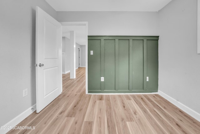 53036 Bird Haven Rd, Centertown, MO 65023 - unfurnished bedroom featuring light wood-type flooring