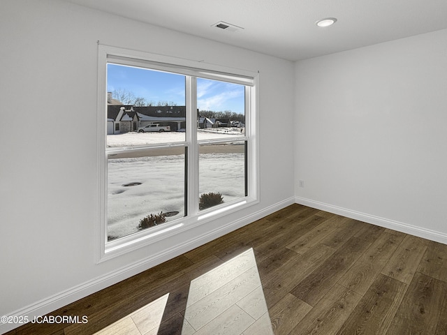 spare room featuring hardwood / wood-style flooring