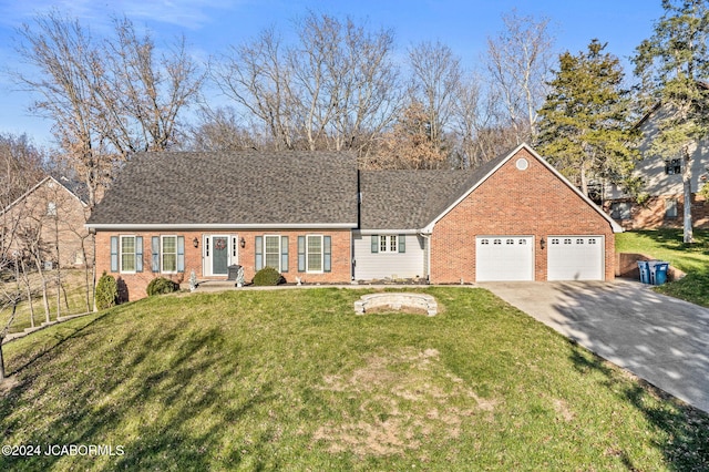 view of front of property featuring a garage and a front lawn