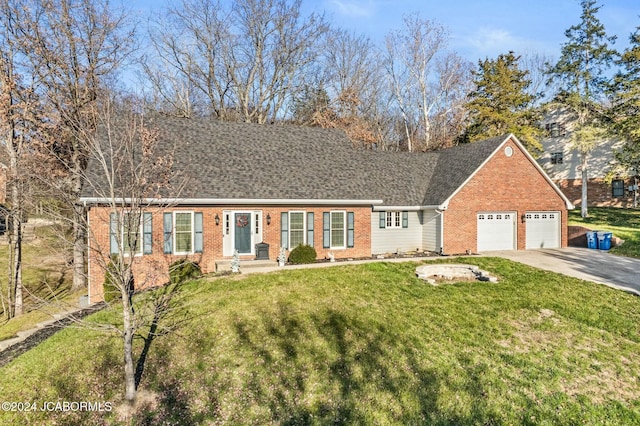 view of front of property featuring a front yard and a garage