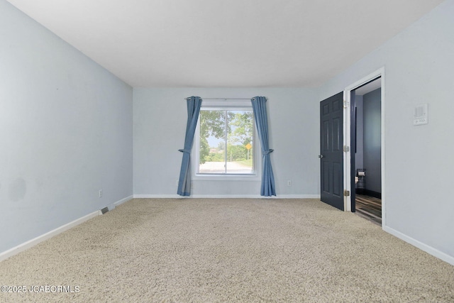 907 Primrose Ln, Jefferson City, MO 65109 - carpeted empty room with baseboards