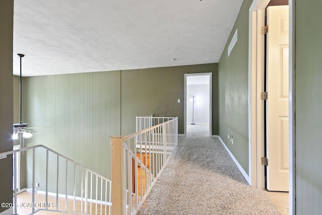 907 Primrose Ln, Jefferson City, MO 65109 - corridor with an upstairs landing and carpet flooring