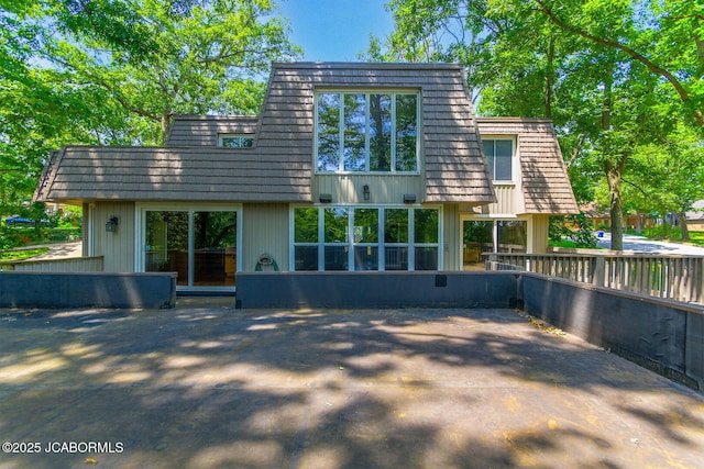907 Primrose Ln, Jefferson City, MO 65109 - rear view of house with mansard roof