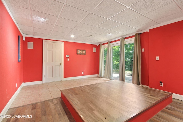 907 Primrose Ln, Jefferson City, MO 65109 - unfurnished room with wood finished floors and a drop ceiling