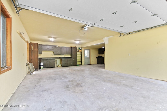 907 Primrose Ln, Jefferson City, MO 65109 - garage featuring a garage door opener
