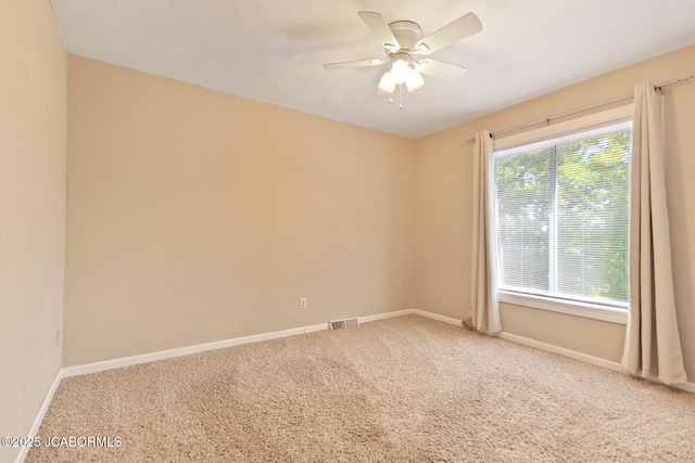907 Primrose Ln, Jefferson City, MO 65109 - spare room featuring carpet and a ceiling fan