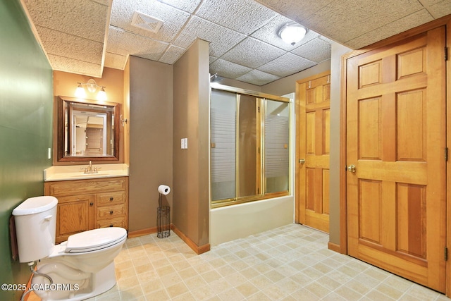 907 Primrose Ln, Jefferson City, MO 65109 - full bathroom featuring vanity, combined bath / shower with glass door, and a drop ceiling