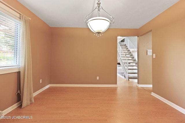 907 Primrose Ln, Jefferson City, MO 65109 - empty room with light wood-type flooring and baseboards