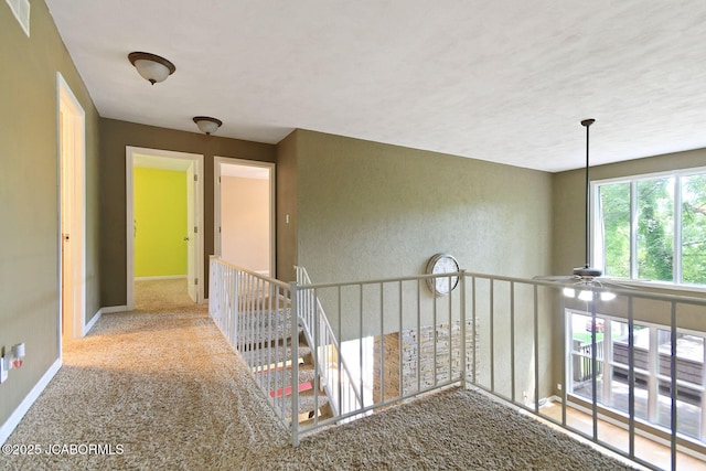 907 Primrose Ln, Jefferson City, MO 65109 - corridor with baseboards and carpet flooring