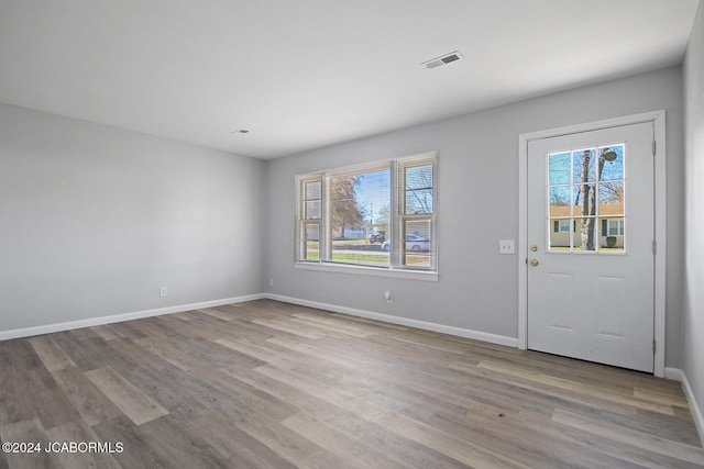 entryway with light hardwood / wood-style flooring