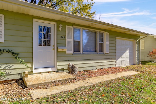 doorway to property featuring a garage