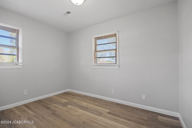 empty room with wood-type flooring