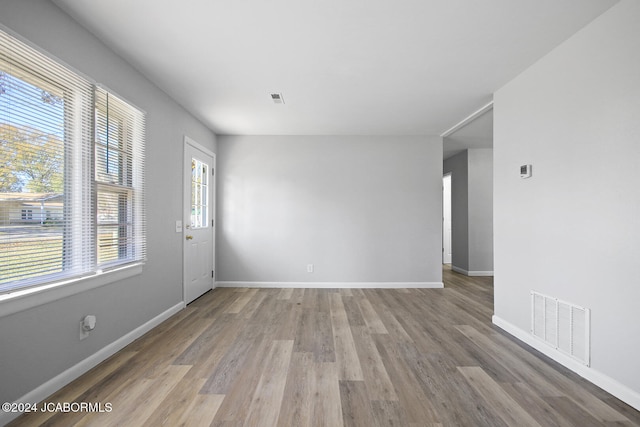 spare room featuring hardwood / wood-style floors