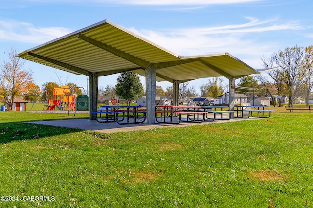 surrounding community with a playground and a lawn