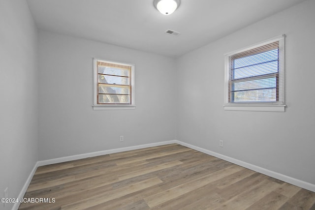 empty room with light hardwood / wood-style floors