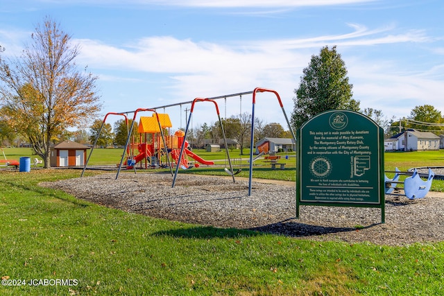 view of jungle gym featuring a lawn