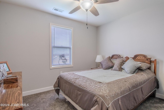 bedroom featuring ceiling fan and dark colored carpet