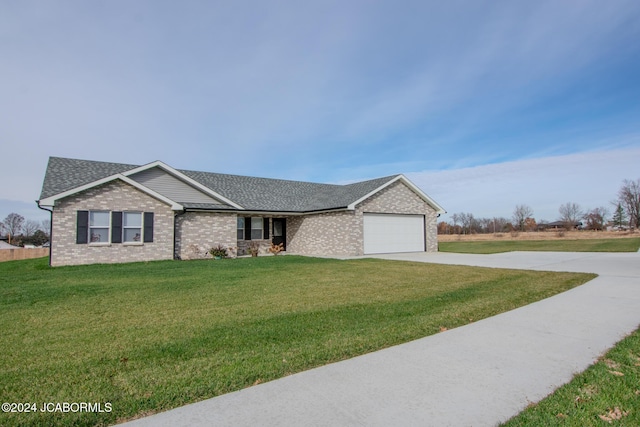 single story home with a garage and a front lawn