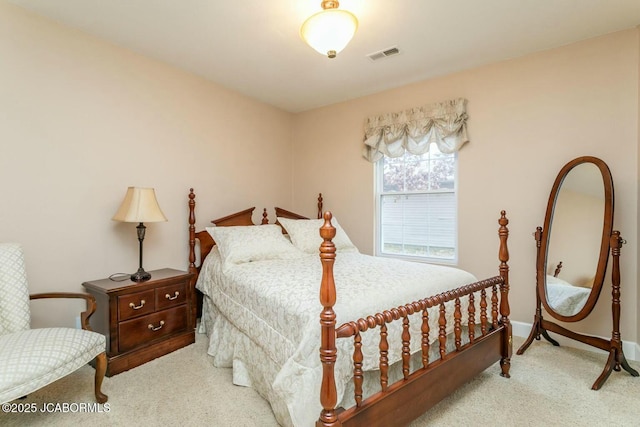 bedroom with carpet, visible vents, and baseboards