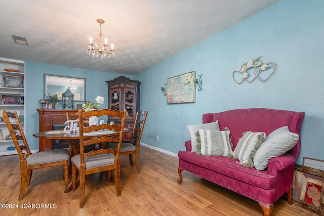 dining room with a chandelier and hardwood / wood-style floors