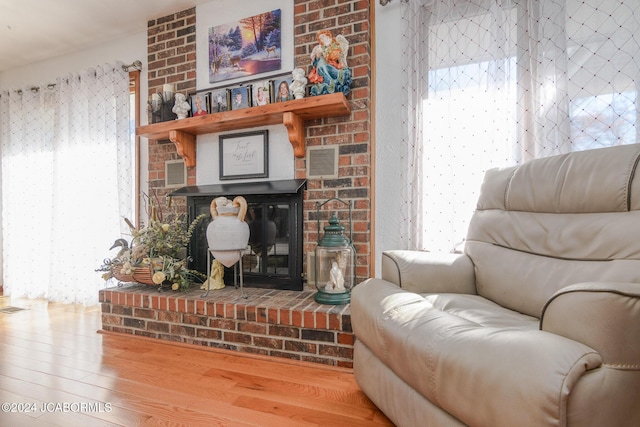 living area with hardwood / wood-style floors