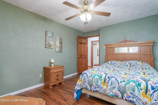 bedroom with ceiling fan and dark hardwood / wood-style floors