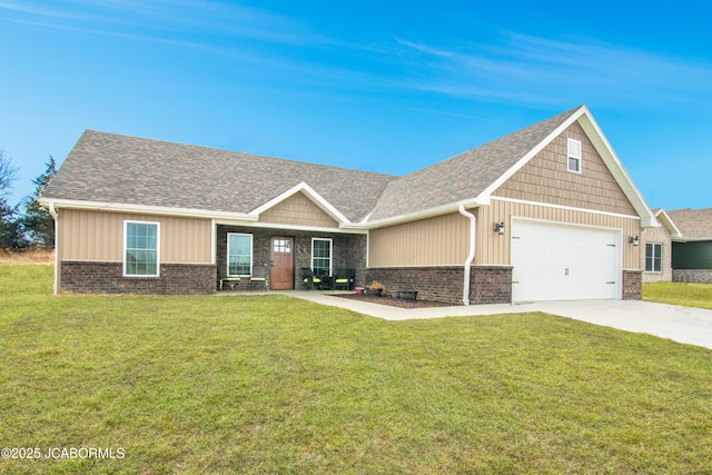 view of front facade with driveway, a garage, a front lawn, and brick siding