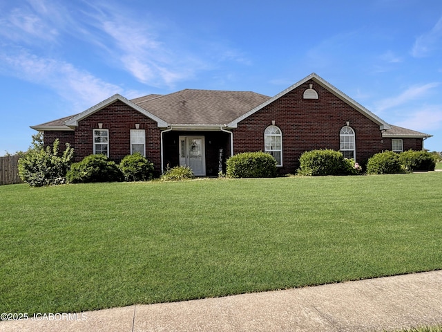 604 Mustang Dr, Ashland, MO 65010 - ranch-style house featuring brick siding, a front lawn, and roof with shingles