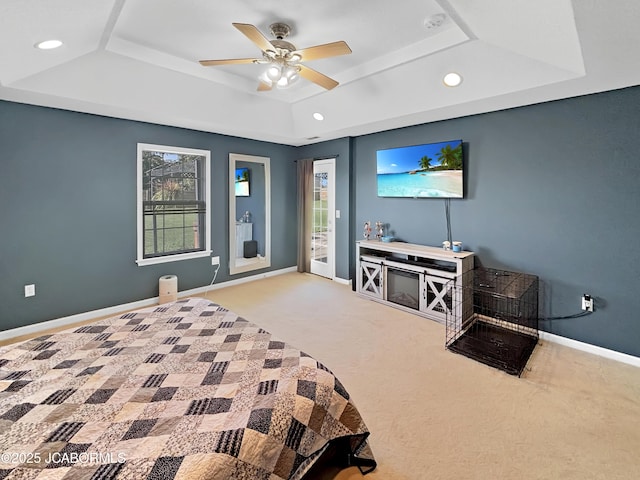 604 Mustang Dr, Ashland, MO 65010 - carpeted bedroom featuring a raised ceiling, access to exterior, multiple windows, recessed lighting, and a ceiling fan