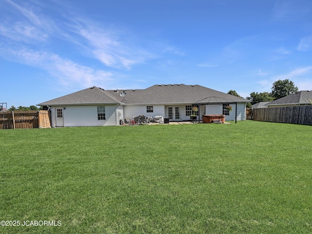 604 Mustang Dr, Ashland, MO 65010 - rear view of house featuring a hot tub, french doors, a fenced backyard, and a patio