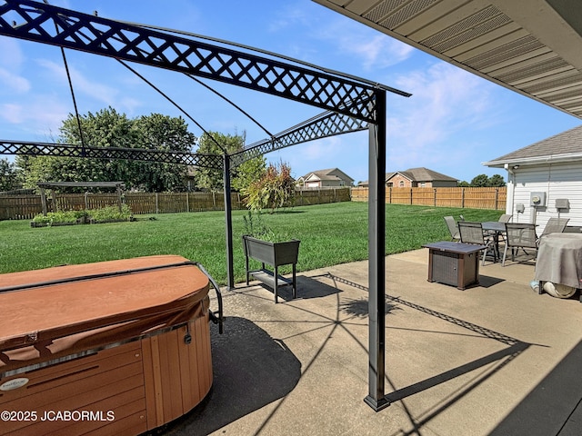 604 Mustang Dr, Ashland, MO 65010 - fenced backyard with a hot tub, a patio area, and outdoor dining area