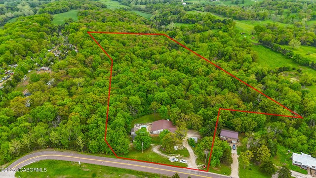 7519 Stringtown Station Rd, Lohman, MO 65053 - aerial view of property and surrounding area featuring a forest and property boundaries highlighted
