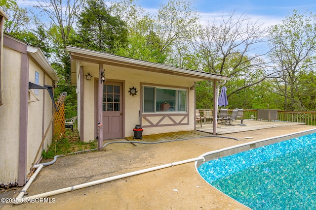 exterior space with a fenced in pool