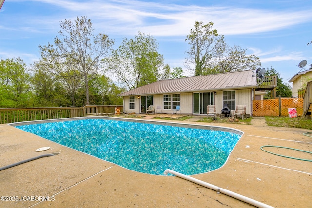 view of pool featuring fence, a fenced in pool, and a patio area