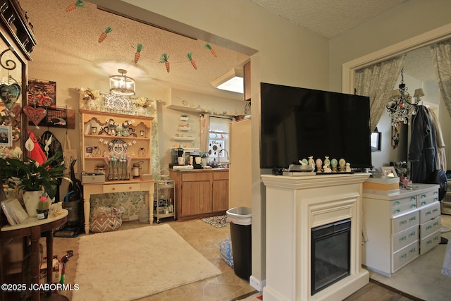 living area with a textured ceiling