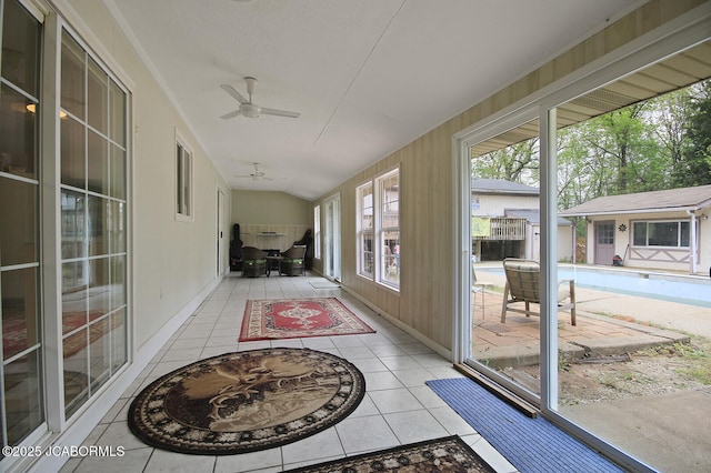 sunroom with a ceiling fan