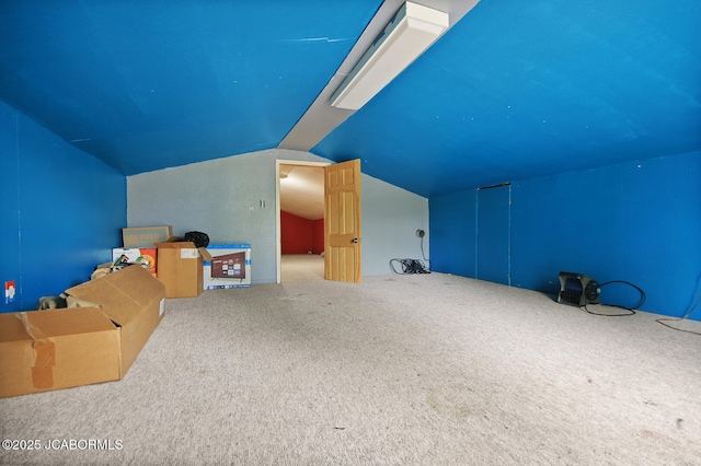 bonus room featuring carpet and lofted ceiling