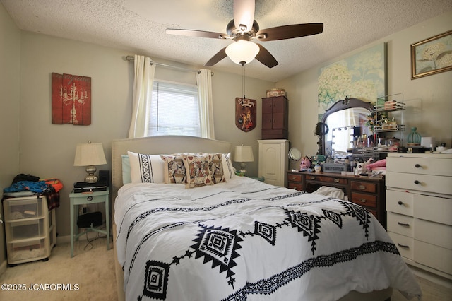 bedroom featuring a ceiling fan and a textured ceiling