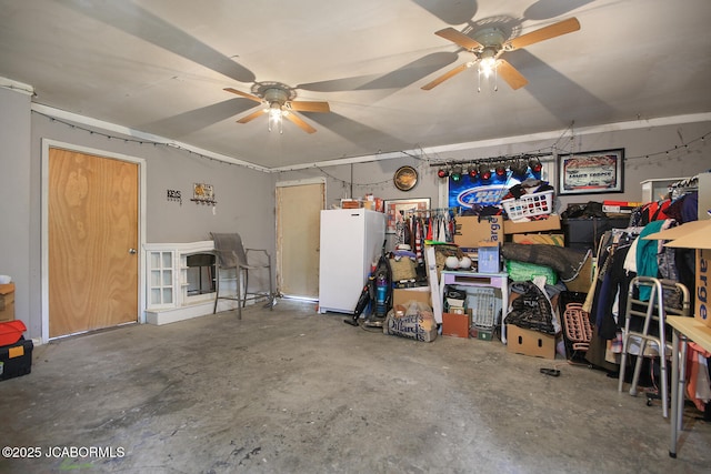 garage featuring ceiling fan and freestanding refrigerator