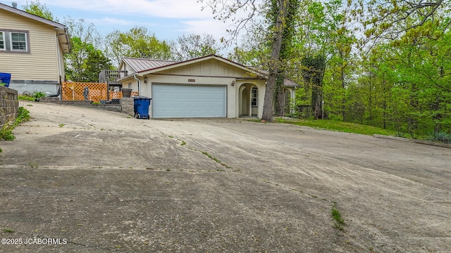 7519 Stringtown Station Rd, Lohman, MO 65053 - garage featuring concrete driveway