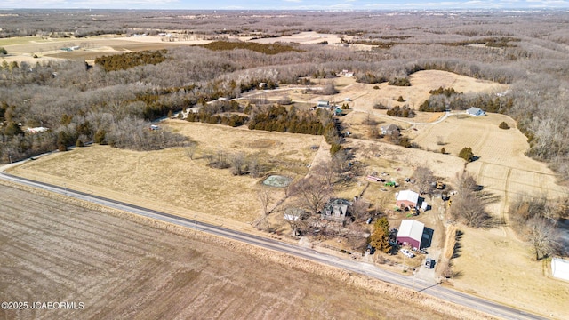 birds eye view of property with a rural view