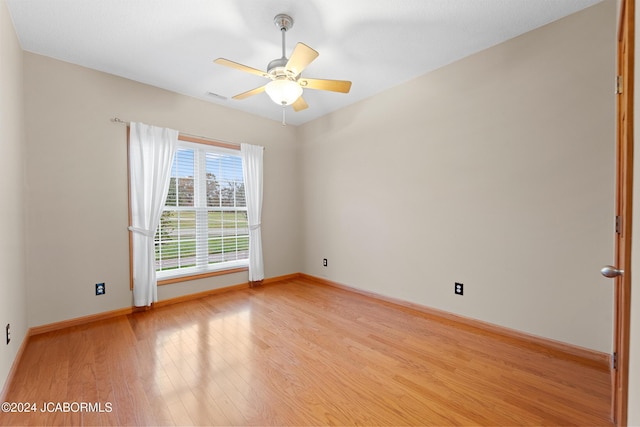 spare room with ceiling fan and light hardwood / wood-style flooring