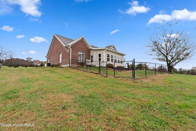 back of property featuring a yard