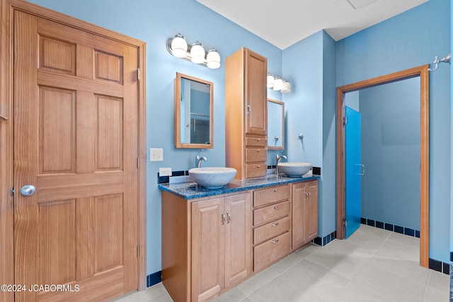 bathroom with tile patterned flooring and vanity