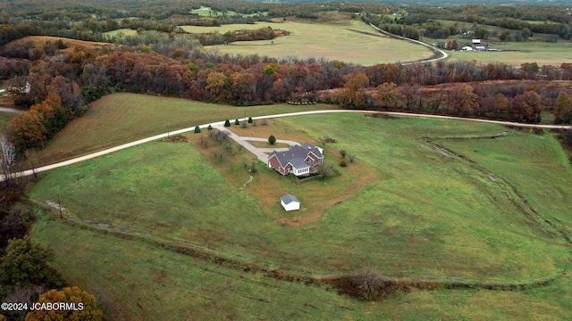 birds eye view of property featuring a rural view