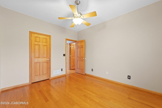 unfurnished bedroom featuring ceiling fan and light wood-type flooring