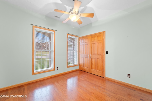 unfurnished room featuring ceiling fan and light hardwood / wood-style flooring