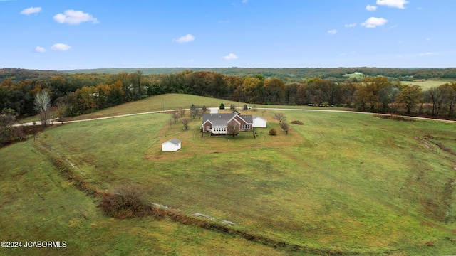 birds eye view of property featuring a rural view